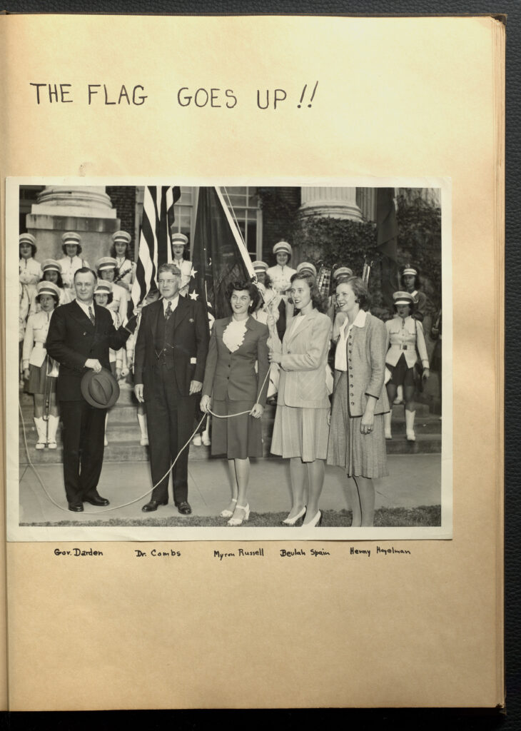 Page with text "The Flag Goes Up!!" with an image underneath showing the minute man flag being raised.