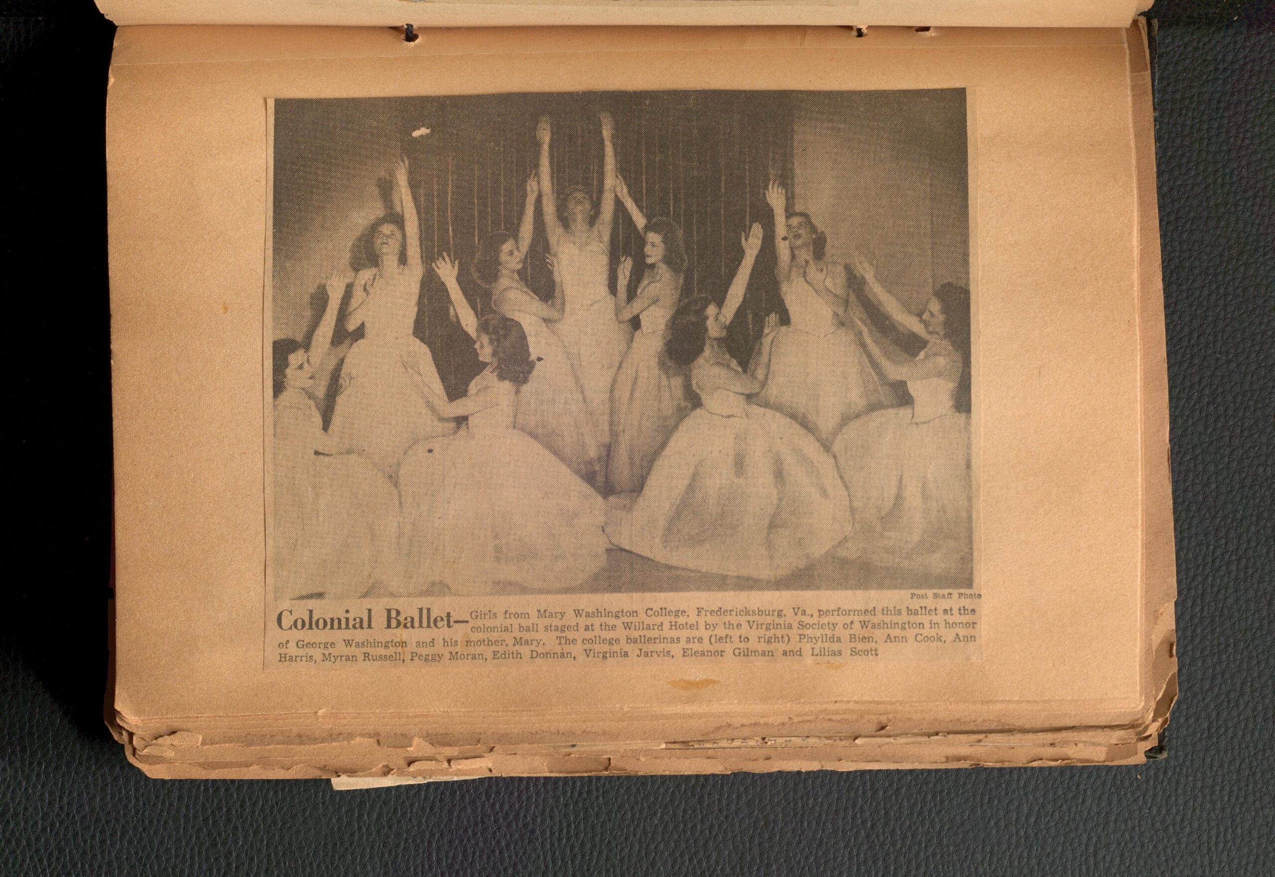 Newspaper clipping on a page from an article about Mary Washington girls putting on a ballet. There's an image of nine women posing in ballet costumes.