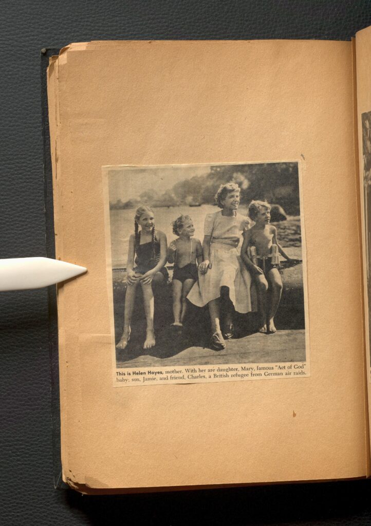 Newspaper clipping on a page. The image is of a mother Helen Hayes with her three children, one a British refugee from German air raids.